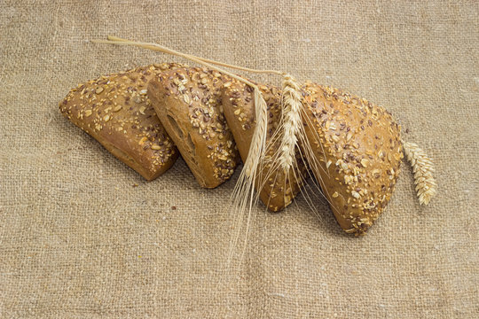Multigrain buns sprinkled with various seeds, and different ears