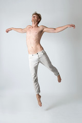 Handsome emotional man jumping