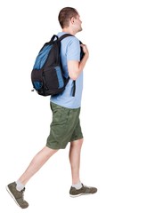 back view of walking  man  with backpack.  brunette guy in motion. backside view of person.  Rear view people collection. Isolated over white background. young man goes to side of a rolling travel bag