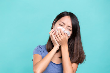 Woman sneezing