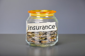 Saving concept of coins in the glass jar for insurance  purpose