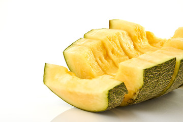 Hamigua Melon cut into slices, Hami Melon, Hami Cantaloupe isolated on white background.