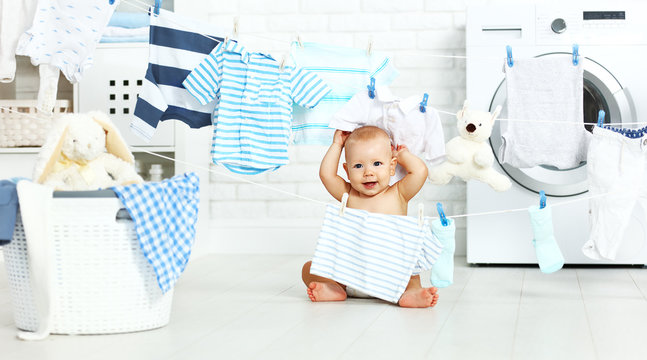 Fun Happy Baby Boy  To Wash Clothes And Laughs In Laundry