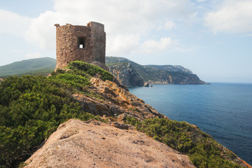 Torre del Porticciolo - Ruins of Ancient Watchtower (Nuraghe) on the Hill over the Porticciolo Beach near Alghero, Sardinia, Italy