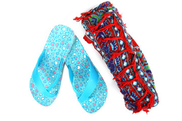 Beach flip flops and sarongs on white isolate background.