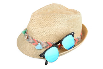Beach hat with sunglasses isolated on white background.
