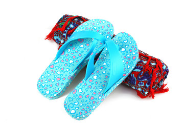 Beach flip flops and sarongs on white isolate background.