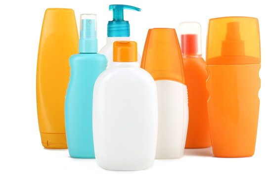 Bottles with suntan cream isolated on white 