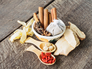 Ingredients for dried herbal soup on wooden table