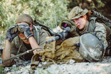 Army sniper during the military operation in the mountain. war,