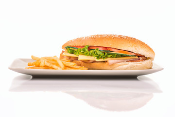 Plate with a sandwich and french fries isolated on a white background