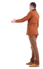 back view of businessman in  movement reaches out to shake hands. Rear view people collection. backside view of person. Isolated over white background.