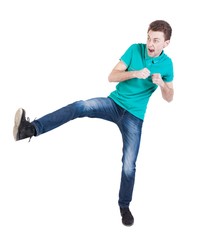 skinny guy funny fights waving his arms and legs. Isolated over white background. Funny guy clumsily boxing. The guy shouts waving foot