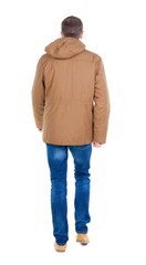 Back view of going  handsome man in brown parka. walking young guy . Rear view people collection.  backside view of person.  Isolated over white background. © ghoststone