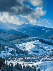 Panorama of Carpathian valley covered by snow