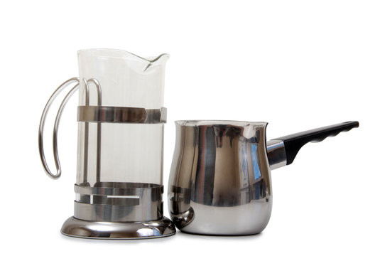 Metal and glass pots for coffee on a white background