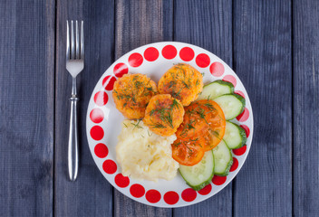 vegetarian food. carrot cutlets with mashed potatoes on the table top view