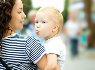 Mother holds child