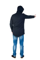 Back view of  pointing young men in parka. Young guy  gesture. Rear view people collection.  backside view of person.  Isolated over white background. Man in warm jacket hood pulled on his head is and