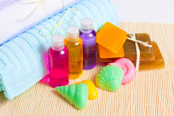 Obraz na płótnie Canvas towels, handmade soap and shower gels