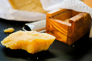 Parmesan cheese. Grated Parmesan cheese. Olive Wood Parmesan Cheese