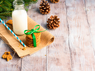 Milk and home made cookies on wooden table