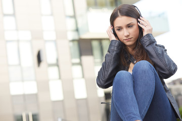 young woman at headphones