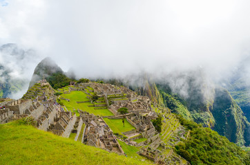 MACHU PICCHU, CUSCO REGION, PERU- JUNE 4, 2013: Panoramic view of the 15th-century Inca citadel Machu Picchu, UNESCO World Heritage Site