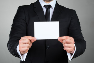 Businessman showing his business card