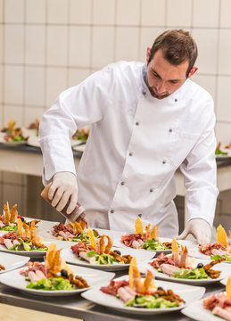 Chef decorating appetizer plate