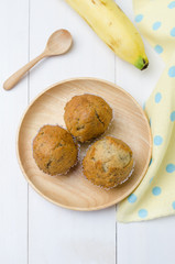 Banana muffins cupcake on wooden background