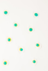 Colorful egg yolk  mock up on soft pauple background. Top view.