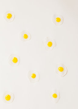 Egg yolk  pattern on soft pauple background. Top view.