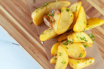 burger and french fries on wooden table