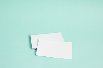 Blank name card mock up on blue background. Side light