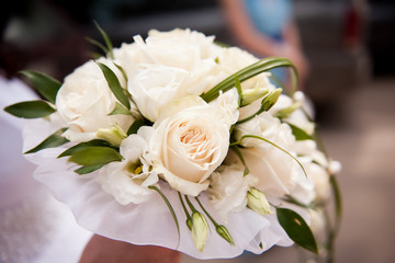 White wedding Bridal bouquet of cream roses, intertwined with green grass