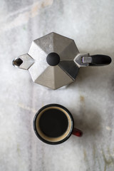 Top view of espresso pot and coffee cup