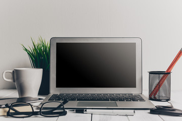 Fototapeta premium Laptop and other electronics on workspace