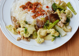 stir fried mixed vegetable with pork and spicy shrimp paste on rice