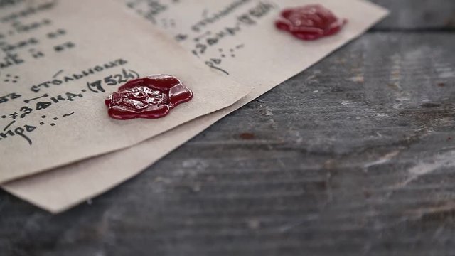 Antique letters with official heraldic stamps. Two ancient manuscripts. Old papers lies on the table