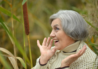 senior woman in  autumn park