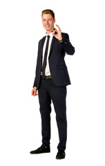 Obraz premium Young business man showing ok sign isolated