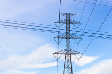 high voltage electric pole with blue sky, horizintal picture