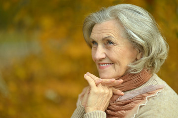 senior woman in  autumn park
