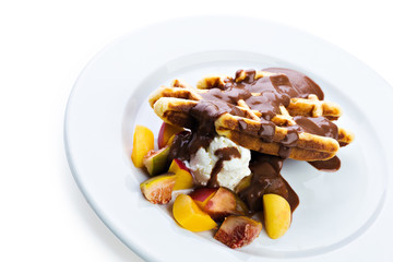 Belgium waffles with fresh berries and chocolate sauce