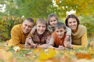 Fototapeta premium Family relaxing in autumn park