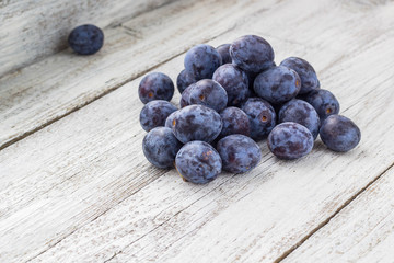 Fresh plums in cup