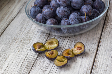 Fresh plums in cup