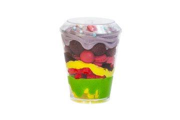dessert in plastic cups cream with fruit and pastries and mousse