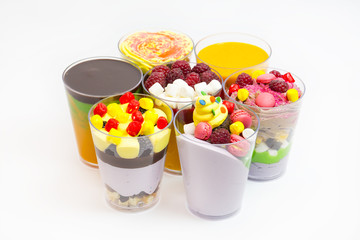 dessert in plastic cups cream with fruit and pastries and mousse